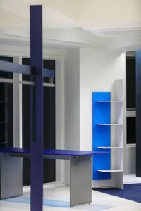 Modern home office environment featuring a metal and glass structural design.