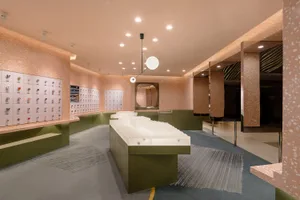 Modern retail store interior with white and green terrazzo flooring.