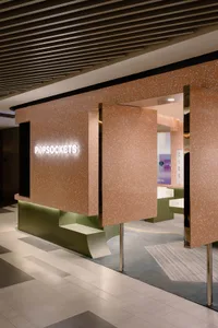 Modern terrazzo and concrete storefront entrance for a retail store.