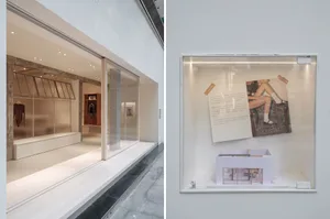 Minimalist showroom with transparent glass walls and white interiors.