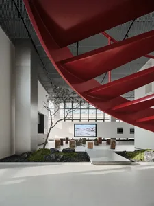 Interior design of a modern commercial space featuring a metallic spiral staircase.