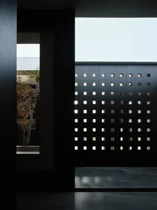Modern interior design featuring a metal grid wall