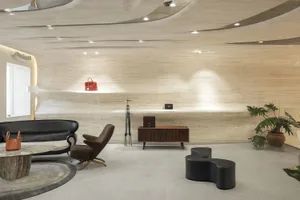 Modern living room featuring wood accents, leather furniture, and fabric upholstery.