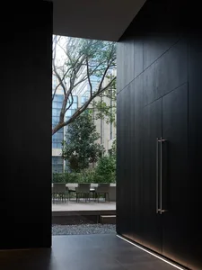 Modern residential interior featuring wooden panels and lighting