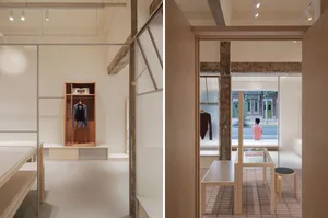 Modern retail storefront showcasing a minimalist design with glass and wooden elements.