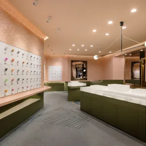 A modern retail store featuring a terrazzo and concrete interior design.