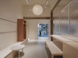 Modern retail storefront with minimalist design features, showcasing contemporary aesthetics and clean lines.