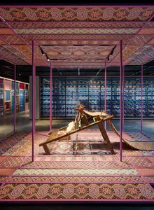 An exhibition showcasing intricate patterns and designs within an interior space.