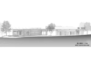 Modern building with glass exterior, viewed from the west.