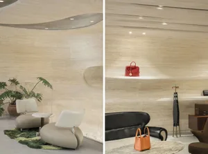A retail shop with modern design features showcasing a wooden interior and a display shelf with a red handbag.