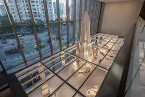 Modern retail space with wooden furniture and design elements.