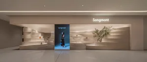 A modern retail storefront with concrete elements and a minimalist design.