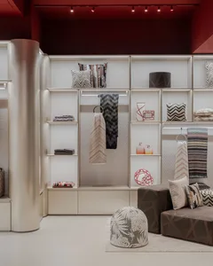 A modern interior display featuring textiles and storage solutions.