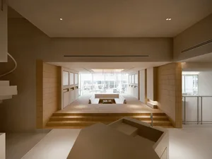 A modern office space featuring concrete vertical columns and clean lines.