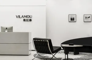 Modern office space featuring concrete furniture and minimalist decor.