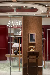 Modern retail storefront featuring wooden interior design elements and a vintage telephone.