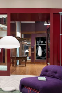 Modern retail storefront featuring glass walls and interior design elements.