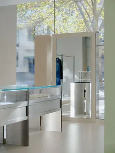 Modern retail storefront featuring glass, metal, and mirrors.