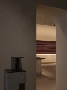 A minimalist, modern interior space featuring concrete materials.