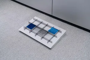 Minimalist interior design featuring a modular metal system with geometric shapes and blue and gray textures.