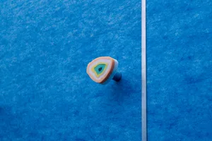 Minimalist DIY ceramic drawer handle in orange, yellow, and teal colors