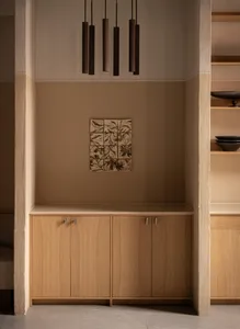 Modern minimalist wooden kitchen cabinets with a sleek design.
