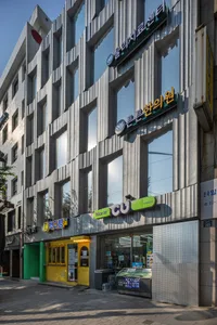 Modern urban storefront with metal cladding and glass front