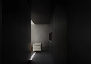A minimalist living room featuring concrete walls, a single white armchair, and a television.
