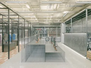 Modern retail space with metallic shelving and glass display cases.