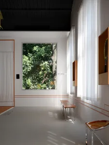 A minimalist white room interior featuring wooden benches, transparent furniture, and large windows with sheer curtains.