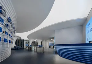 A modern commercial interior designed with glass walls and concrete elements.