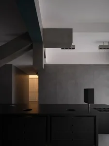 Modern kitchen with concrete walls and floor, minimalist design aesthetic