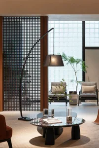 A modern, minimalist living room with metal, wood, and glass materials and a simple, functional design.