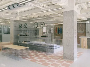 A modern retail store featuring a metal cage display.