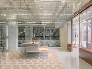 A modern retail space with metal, glass, and concrete elements.