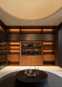 Modern wine room with wooden shelves and marble accents