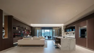 Modern residential interior featuring marble countertops and concrete flooring.