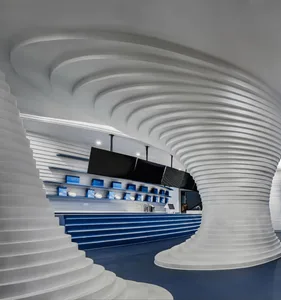 A modern retail space featuring plastic columns and a wave-like ceiling design.