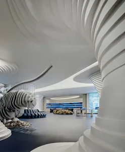 A modern retail space featuring concrete structures and artistic elements.