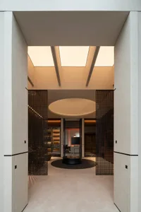 A modern wine cellar with wooden elements, located indoors.