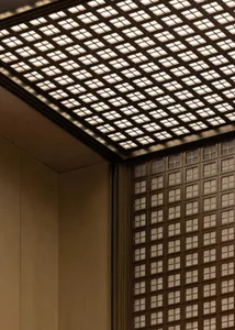 Metallic glass paneling in an industrial interior space