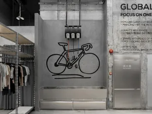 An industrial-style retail store with concrete walls and minimalist design.