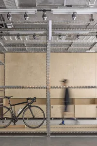 A minimalist interior space featuring metallic shelving.