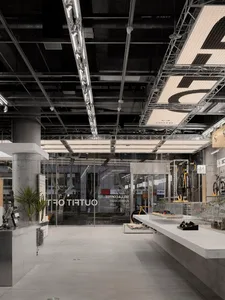 Modern retail space featuring concrete, metal, and glass materials