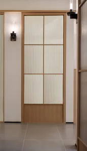 Modern room with a glass panel door.