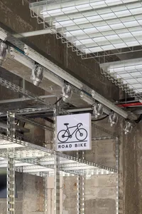 Industrial-style metallic shelving unit designed for road bikes