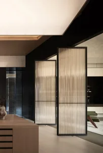 Closed glass kitchen cupboard in a modern kitchen setting.