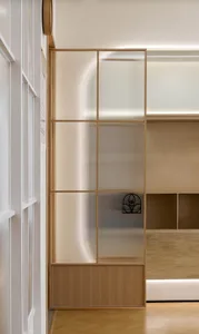 Modern office space featuring glass walls and minimalist design elements