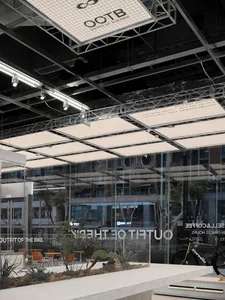 Modern retail storefront featuring glass walls, concrete flooring, and steel accents.