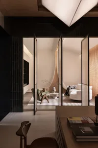 Modern living room with concrete walls and black tiles.